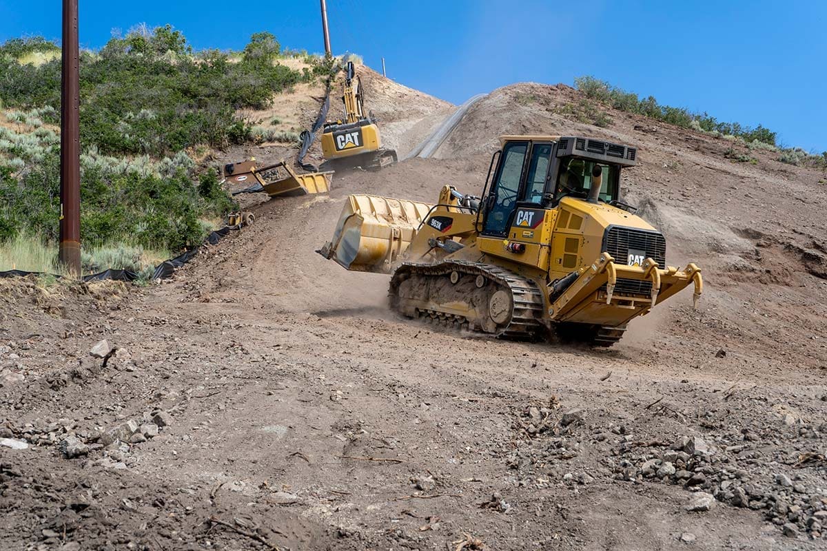 Hauling concrete in a Track Loader up the mountain at Jordanelle Pipeline Project for JSSD