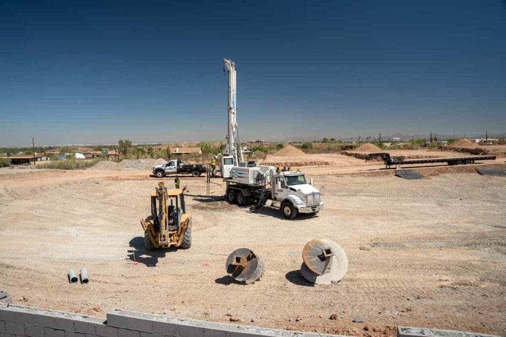 wheeled drill rig auger operation for dry well construction.
