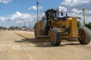 Leveling the subgrade material before concrete paving
