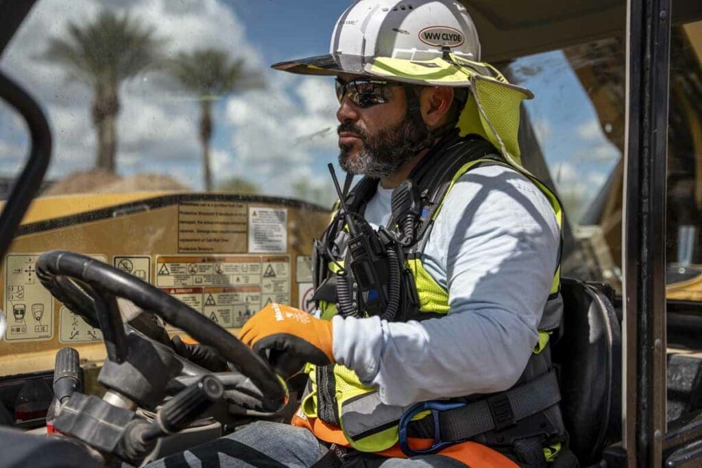 Dry well construction team member for WW Clyde Boom operator