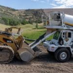 Moving concrete up a mountain side in a track loader